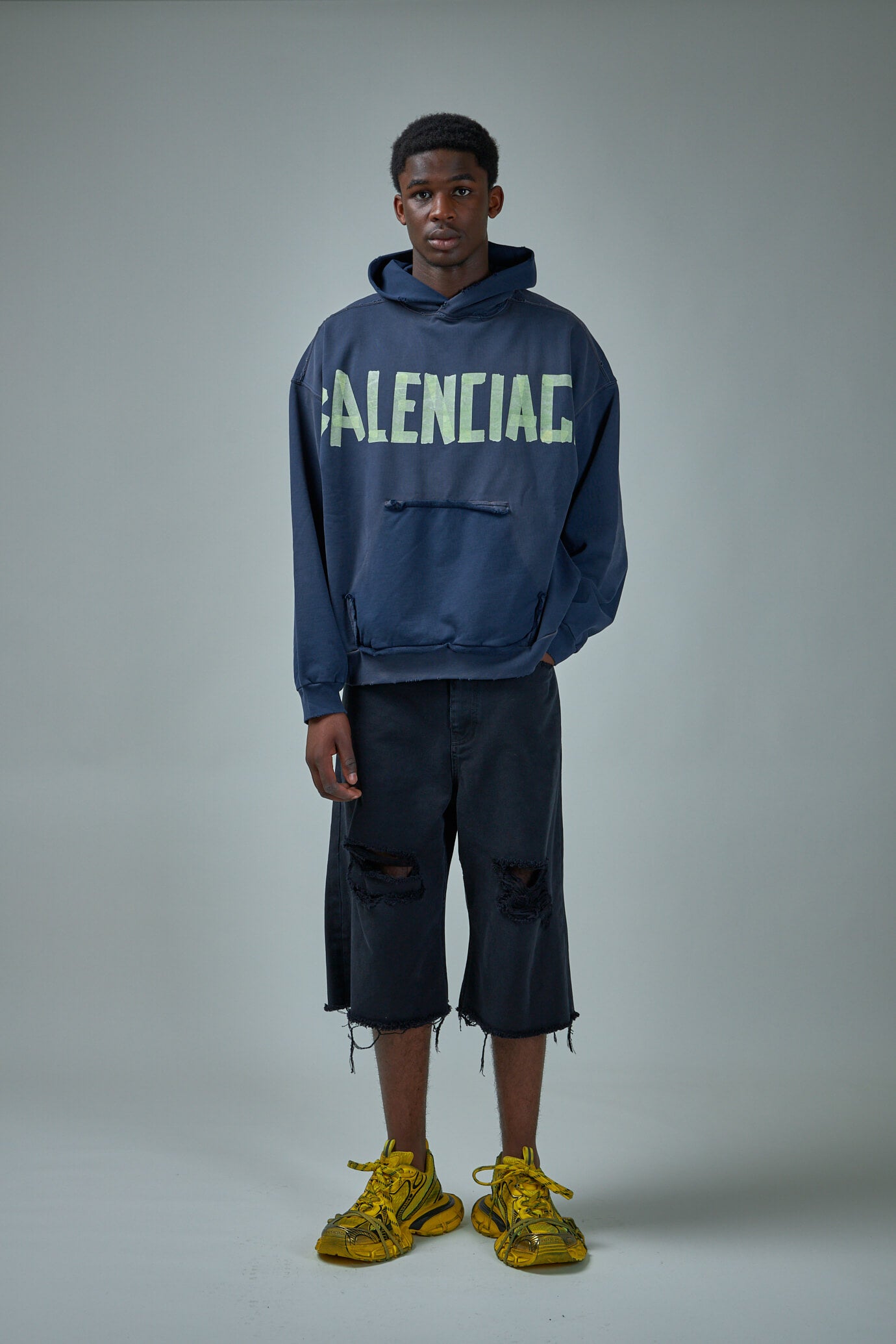 Balenciaga Ripped Pocket Hoodie in Washed Black  FWRD